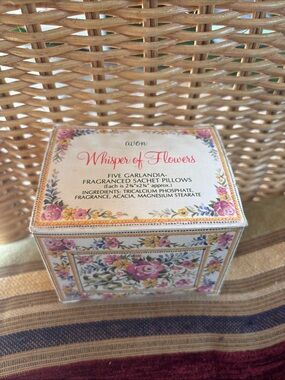 vintage 1980 Avon "Whisper of Flowers" set featuring five sachet pillows